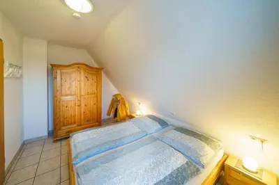 Ein Bett oder Betten in einem Zimmer der Unterkunft Achtern Diek 28A