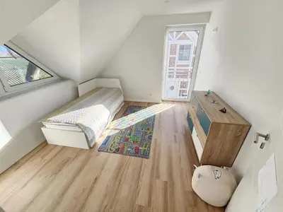 Ein Bett oder Betten in einem Zimmer der Unterkunft Ferienhaus im Angerdorf