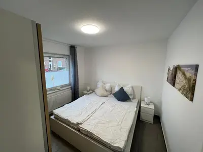 Ein Bett oder Betten in einem Zimmer der Unterkunft Residenz Cux-Havenglück