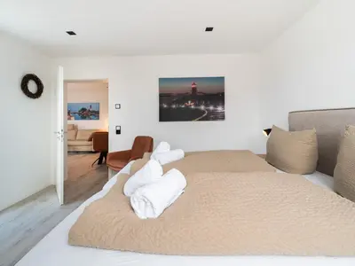 Ein Bett oder Betten in einem Zimmer der Unterkunft Inseltörn Wohnung 10