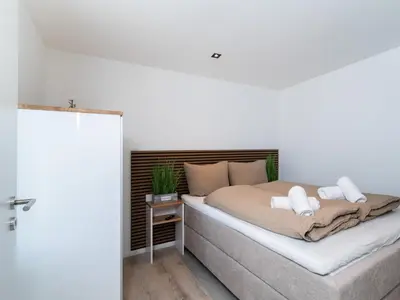 Ein Bett oder Betten in einem Zimmer der Unterkunft Inseltörn Wohnung 12