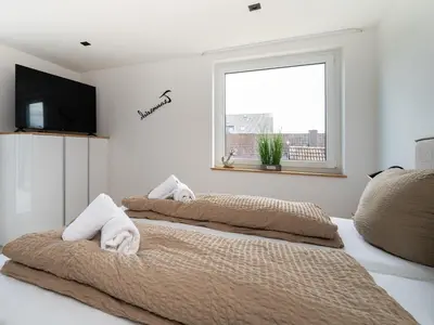Ein Bett oder Betten in einem Zimmer der Unterkunft Inseltörn Wohnung 11