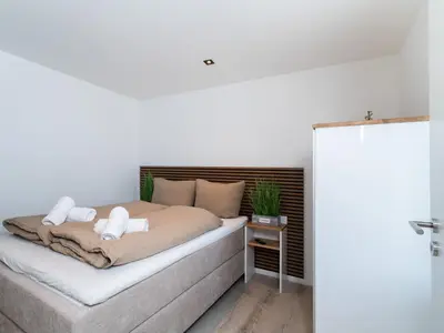 Ein Bett oder Betten in einem Zimmer der Unterkunft Inseltörn Wohnung 9