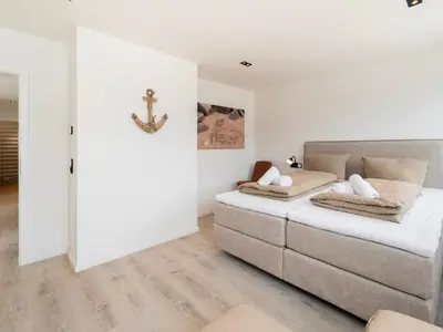Ein Bett oder Betten in einem Zimmer der Unterkunft Inseltörn Wohnung 8
