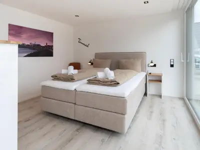 Ein Bett oder Betten in einem Zimmer der Unterkunft Inseltörn Wohnung 4