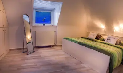 Ein Bett oder Betten in einem Zimmer der Unterkunft Ferienwohnung Gooß
