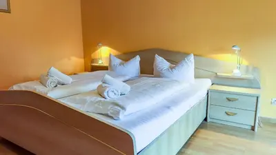 Ein Bett oder Betten in einem Zimmer der Unterkunft Kamps Schillingshof 3