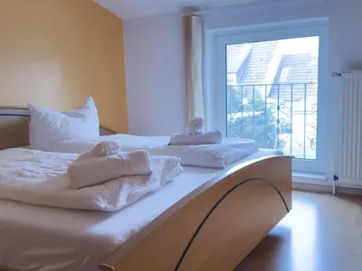 Ein Bett oder Betten in einem Zimmer der Unterkunft Kamps Schillingshof 2