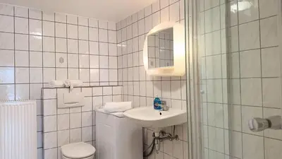Ein Badezimmer in der Unterkunft Kamps Schillingshof 2