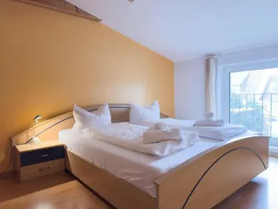 Ein Bett oder Betten in einem Zimmer der Unterkunft Kamps Schillingshof 2