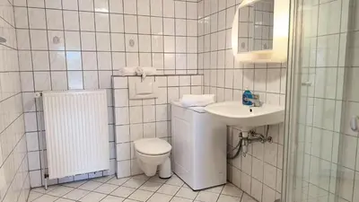 Ein Badezimmer in der Unterkunft Kamps Schillingshof 2