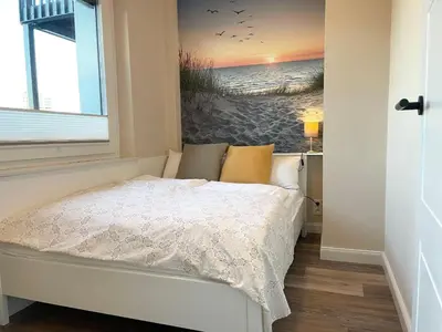 Ein Bett oder Betten in einem Zimmer der Unterkunft Seaside 53 Grad FeWo 5