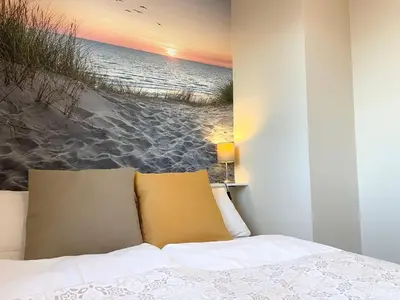 Ein Bett oder Betten in einem Zimmer der Unterkunft Seaside 53 Grad FeWo 5