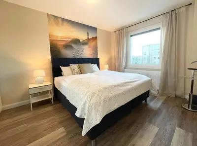 Ein Bett oder Betten in einem Zimmer der Unterkunft Seaside 53 Grad FeWo 5