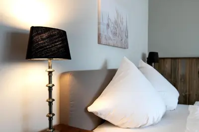 Ein Bett oder Betten in einem Zimmer der Unterkunft Top gelegene FeWo Strandkoje an der Perlebucht
