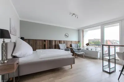 Ein Bett oder Betten in einem Zimmer der Unterkunft Top gelegene FeWo Strandkoje an der Perlebucht