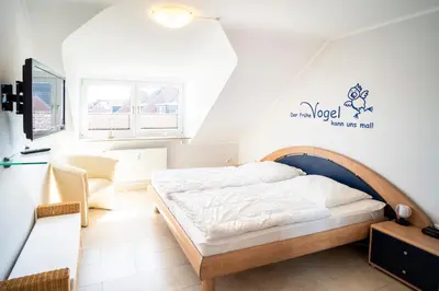Ein Bett oder Betten in einem Zimmer der Unterkunft Duhner Ausblick mit Balkon