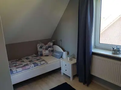 Ein Bett oder Betten in einem Zimmer der Unterkunft Holiday cottage on the dike Comfortable holiday residence
