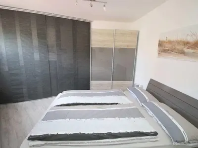 Ein Bett oder Betten in einem Zimmer der Unterkunft ToNi