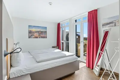 Ein Bett oder Betten in einem Zimmer der Unterkunft Resort Deichgraf