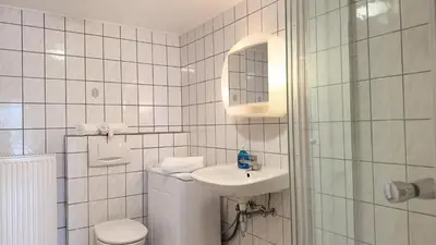 Ein Badezimmer in der Unterkunft Schilingshof WHG 2