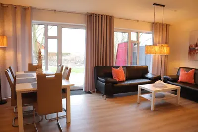 Ein Sitzbereich in der Unterkunft Ferienhaus Nordlicht
