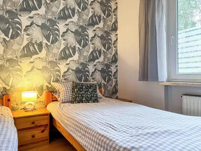 Ein Bett oder Betten in einem Zimmer der Unterkunft Strandnahe Ferienwohnung Haus Sonneneck 2