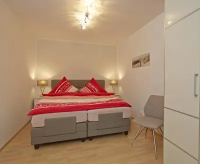 Ein Bett oder Betten in einem Zimmer der Unterkunft Ferienwohnung in Otterndorf