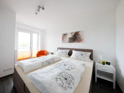 Ein Bett oder Betten in einem Zimmer der Unterkunft De Kohbloom