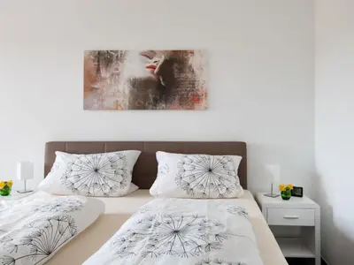 Ein Bett oder Betten in einem Zimmer der Unterkunft De Kohbloom