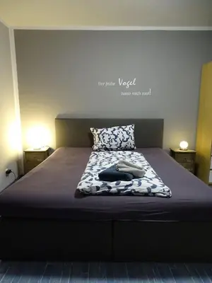 Ein Bett oder Betten in einem Zimmer der Unterkunft Fewo-Nordseekueste