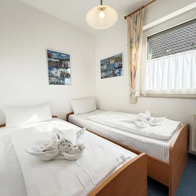 Ein Bett oder Betten in einem Zimmer der Unterkunft Voßhörn 3 Wohnung 2