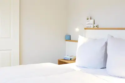 Ein Bett oder Betten in einem Zimmer der Unterkunft Dat-Meerhus Wohnung 3