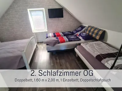 Ein Sitzbereich in der Unterkunft Ferienhaus Odisheim - Hunde herzlich willkommen - hoher Zaun - Terrasse mit Überdachung - familienfreundlich