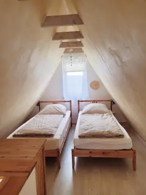Ein Bett oder Betten in einem Zimmer der Unterkunft Ferienhaus ROSA mit Sauna