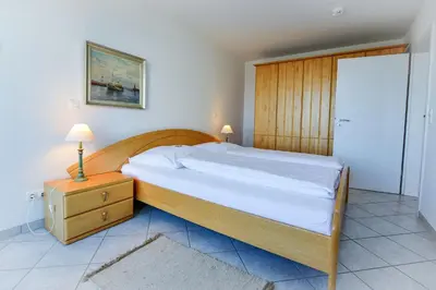 Ein Bett oder Betten in einem Zimmer der Unterkunft Haus Nordseebrandung ND62