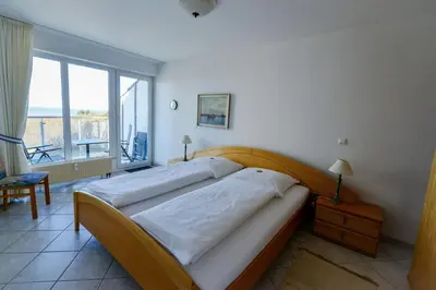 Ein Bett oder Betten in einem Zimmer der Unterkunft Haus Nordseebrandung ND62