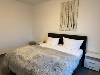 Ein Bett oder Betten in einem Zimmer der Unterkunft Pier 1 bis 4 gmütliche Zimmer mit Boxspringbett