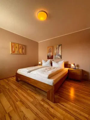 Ein Bett oder Betten in einem Zimmer der Unterkunft Haus Poseidon, Ferienwohnung POS36