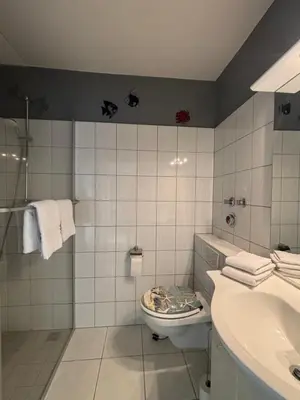 Ein Badezimmer in der Unterkunft Haus Poseidon, Ferienwohnung POS01