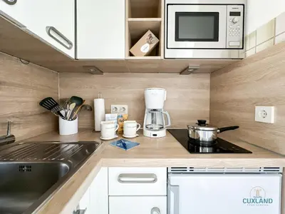 Küche/Küchenzeile in der Unterkunft Haus Jan am Strand Wohnung 204