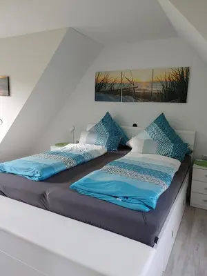 Ein Bett oder Betten in einem Zimmer der Unterkunft Ankerplatz 1