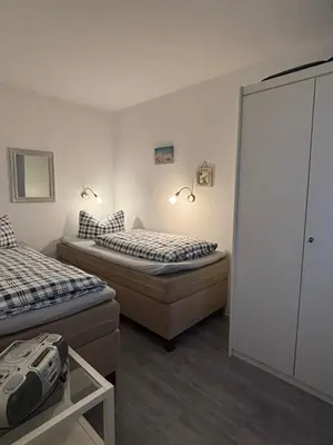 Ein Bett oder Betten in einem Zimmer der Unterkunft Haus Pavillon, Ferienwohnung 13