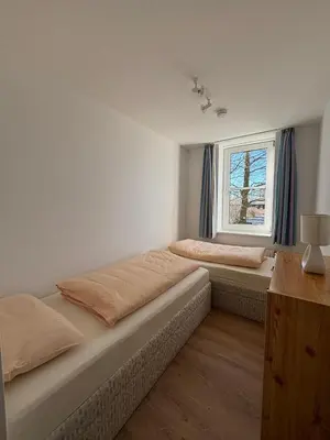Ein Bett oder Betten in einem Zimmer der Unterkunft Haus Hohe Worth, Apartment 112