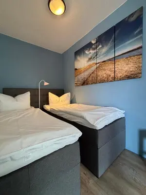Ein Bett oder Betten in einem Zimmer der Unterkunft Haus Poseidon, Apartment POS15