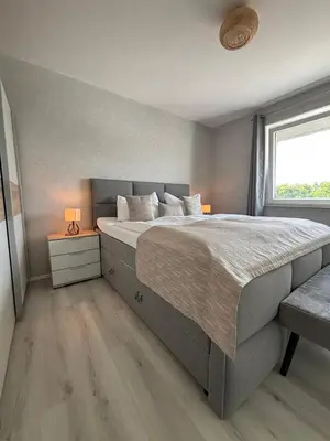 Ein Bett oder Betten in einem Zimmer der Unterkunft Haus Poseidon, Ferienwohnung POS20