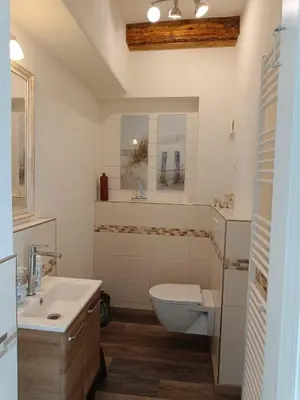 Ein Badezimmer in der Unterkunft Küstenhaus Duhnen - Ferienhaus mit Meerblick