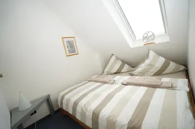 Ein Bett oder Betten in einem Zimmer der Unterkunft Strandlöper