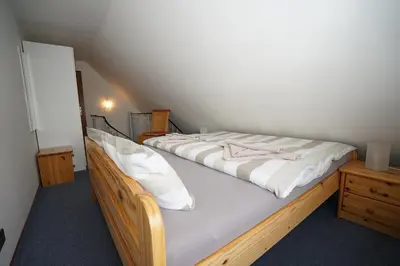 Ein Bett oder Betten in einem Zimmer der Unterkunft Strandlöper