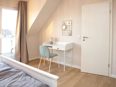 Ein Bett oder Betten in einem Zimmer der Unterkunft Büsum Ahoi inkl Wellness-SPA im Meerzeit